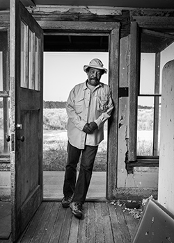 George Junne standing in doorway of Jackson House
