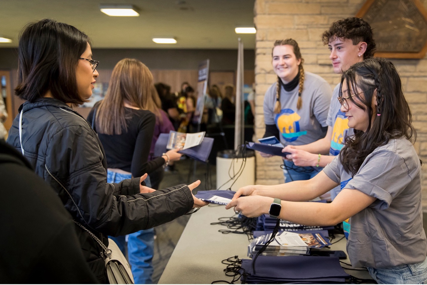 Student volunteers checking people in at the conference.