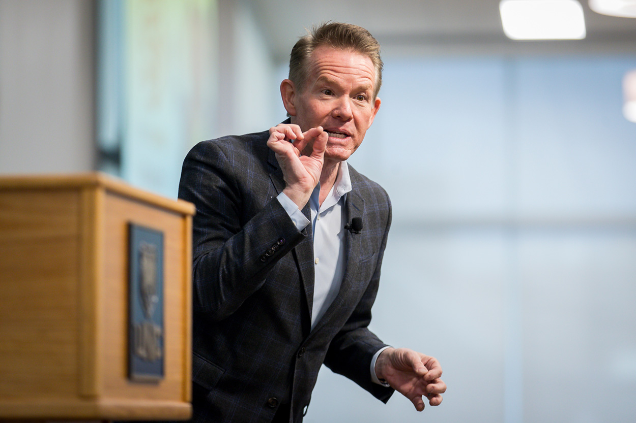 Keynote speaker, Steve Spangler, addressing the audience next to a podium.