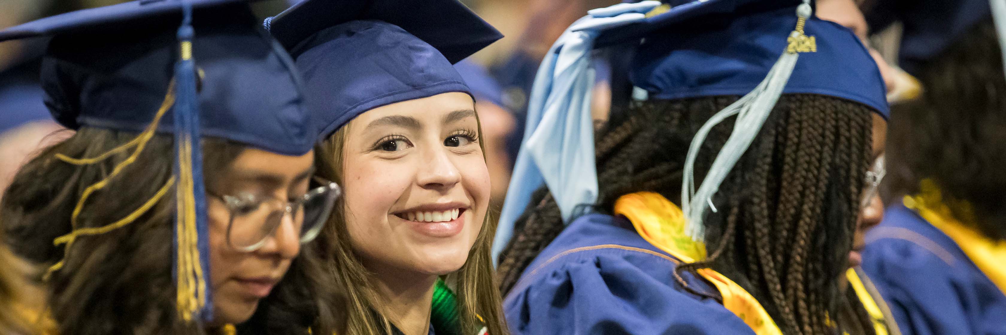 UNC Students gives a thumbs up while waiting for her name to be called.