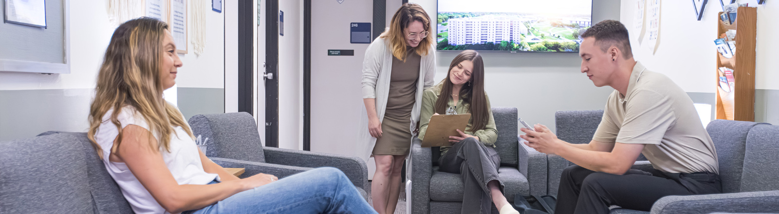 Psychology students sit in the lobby of the Psychology Clinic.