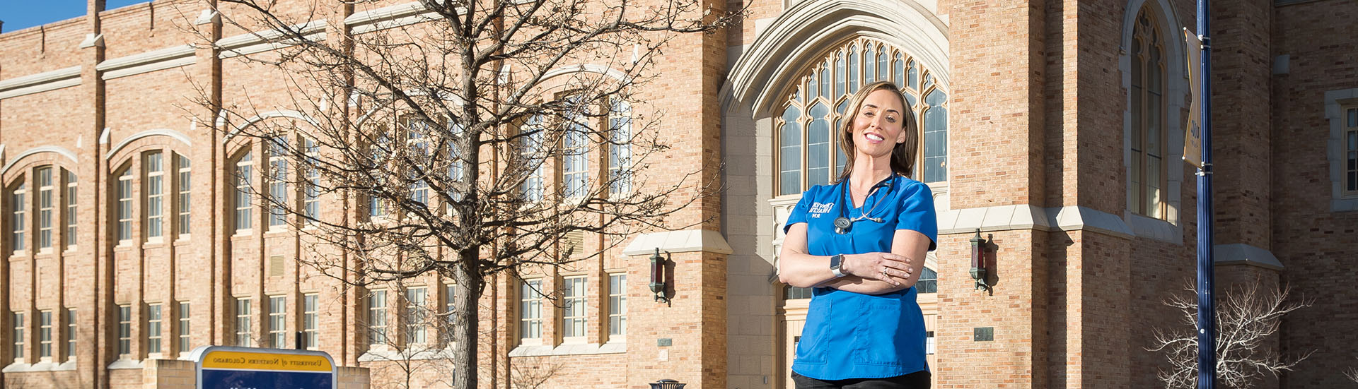 nurse posing outside Gunter hall