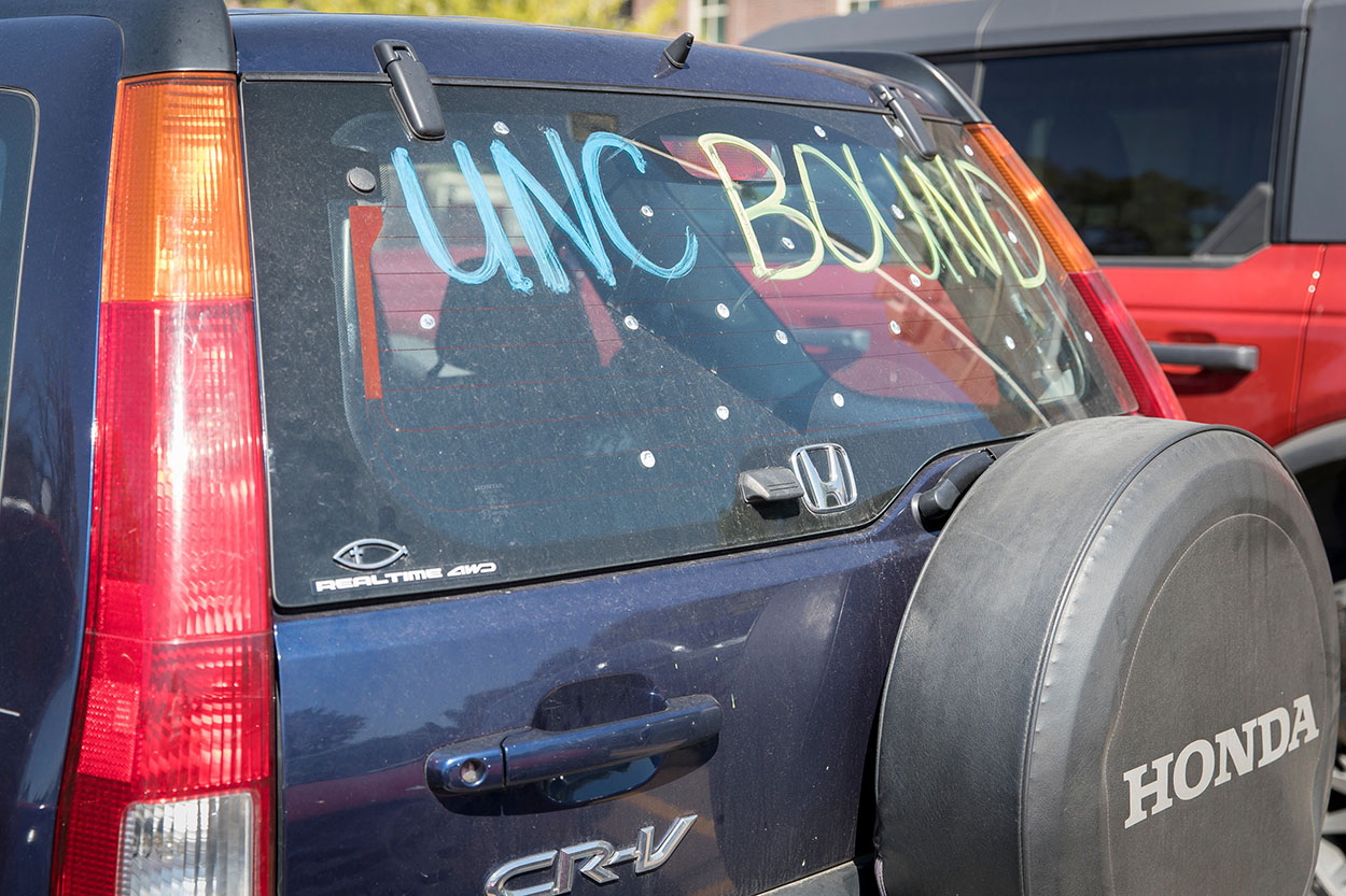 Back car window with the words UNC Bound written on it using paint.