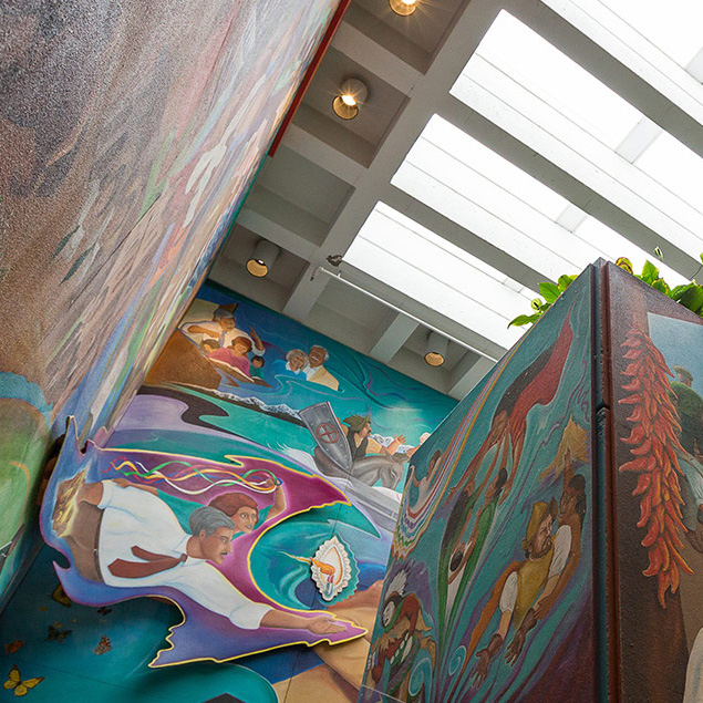 A coloraful mural surrounding a staircase