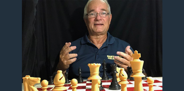 Byron Bridges poses with chess set