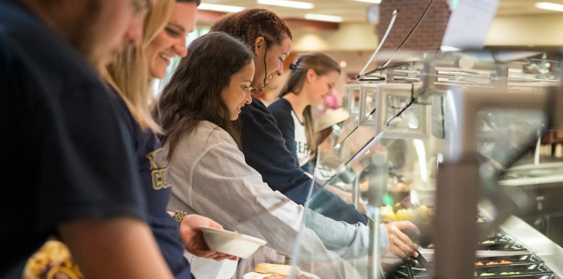 students at UNC getting food at Holmes Dining Hall