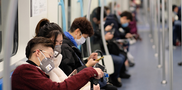 People wearing masks on a train in China