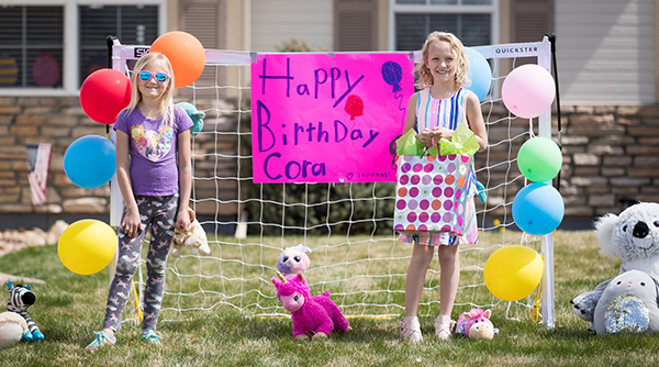 Birthday sign on soccer goal with girls
