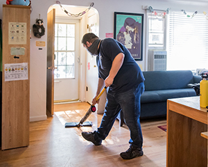 Staff sweeping an office
