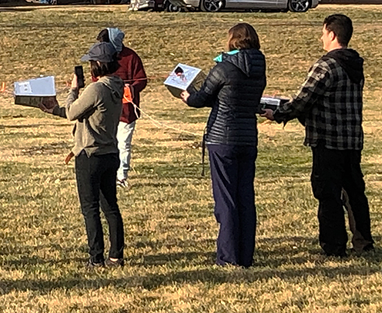 The students holding their payloads, which include sensors and other devices. Stottlemyer is standing second from the right in the dark-blue jacket.