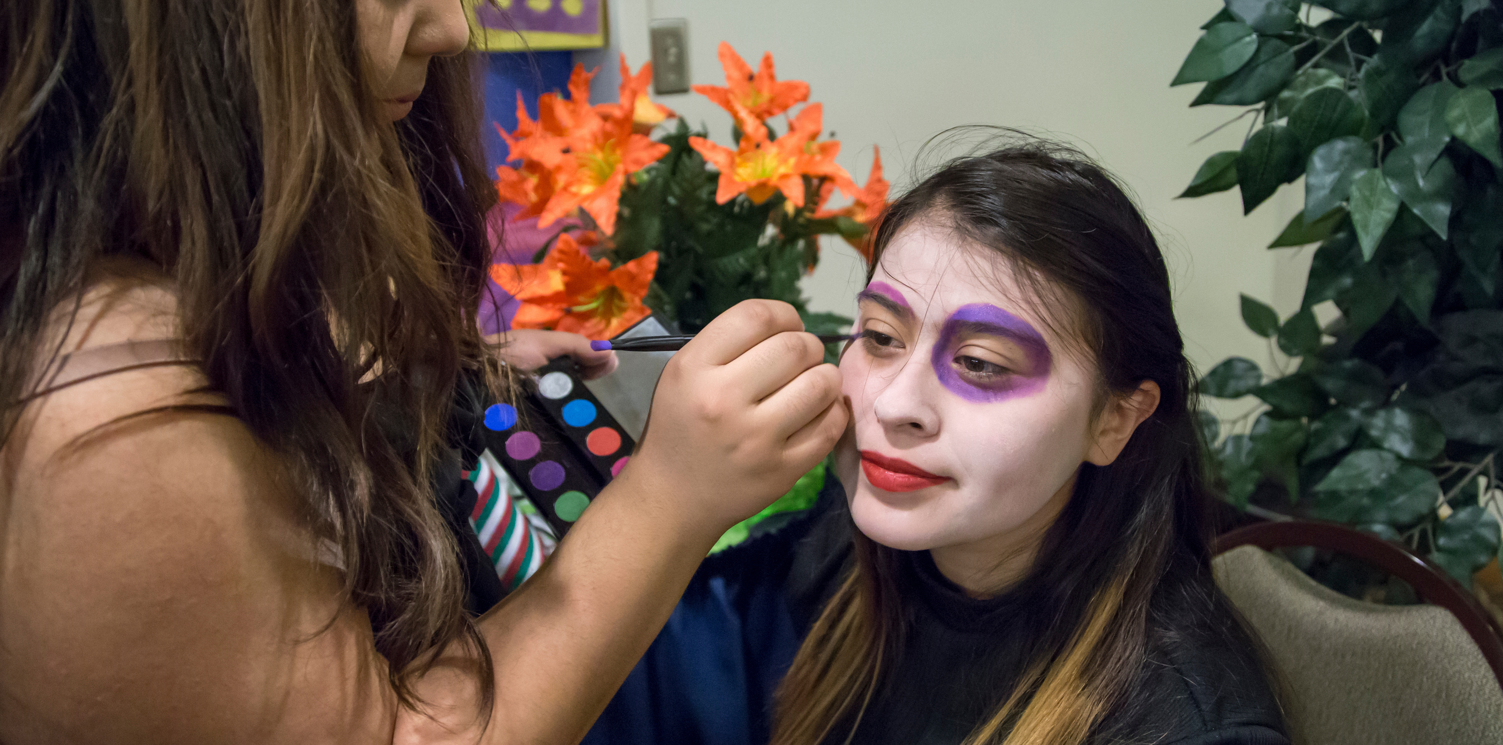 Photo of a female student having her face painted