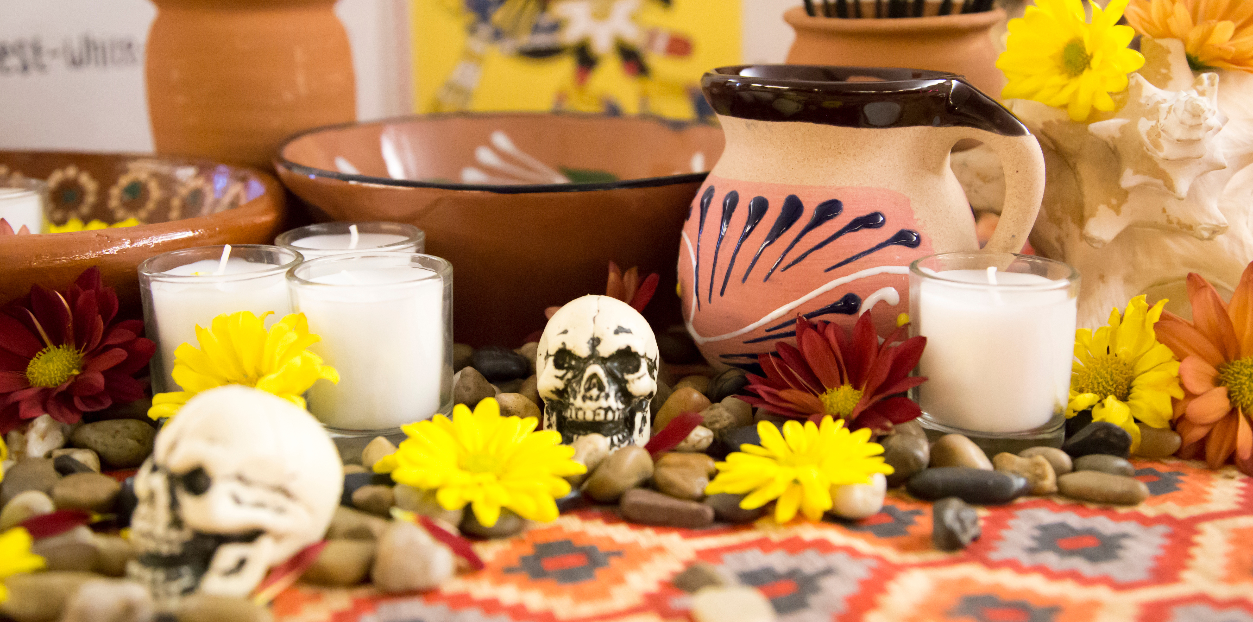 skulls and colorful decorations on a table