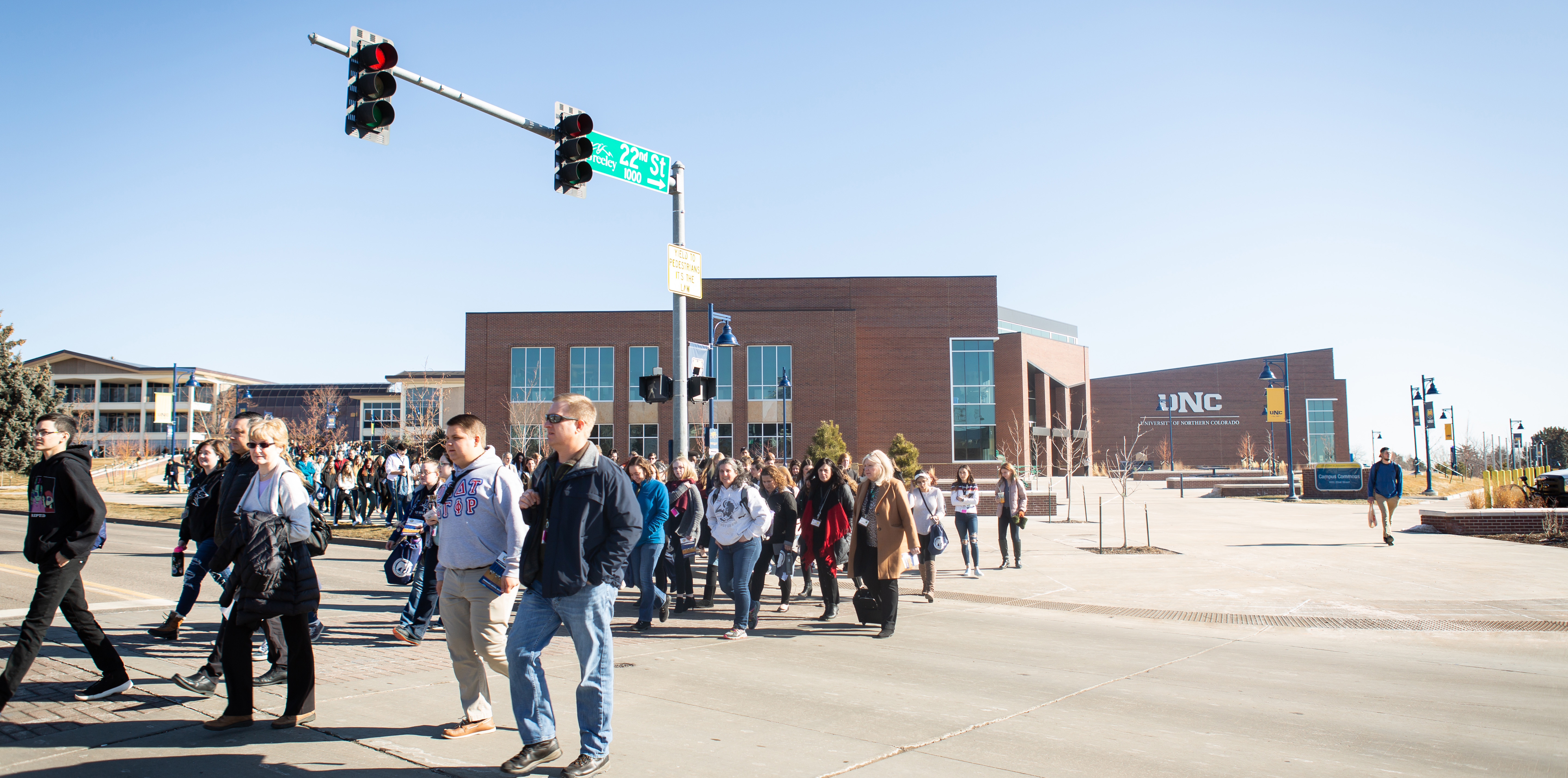 A large group of people walking together outside