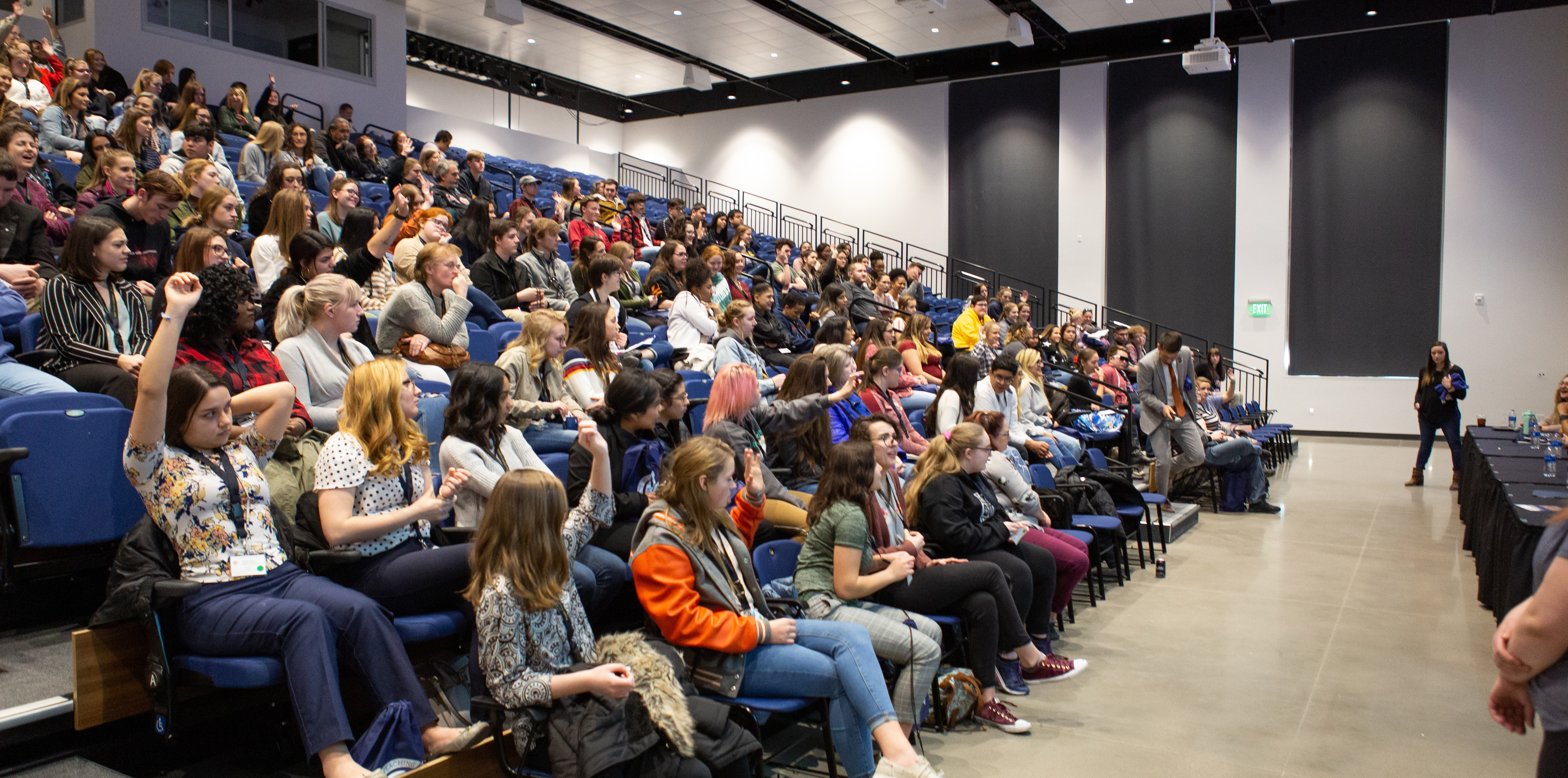 A crowd of students sitting in a an auditorium