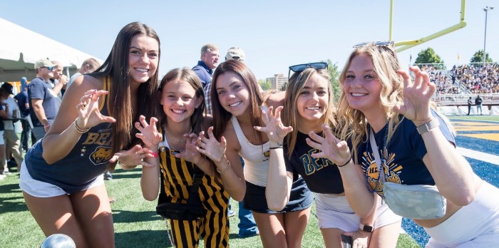 Students showing their Bear Pride at the Homecoming football game.