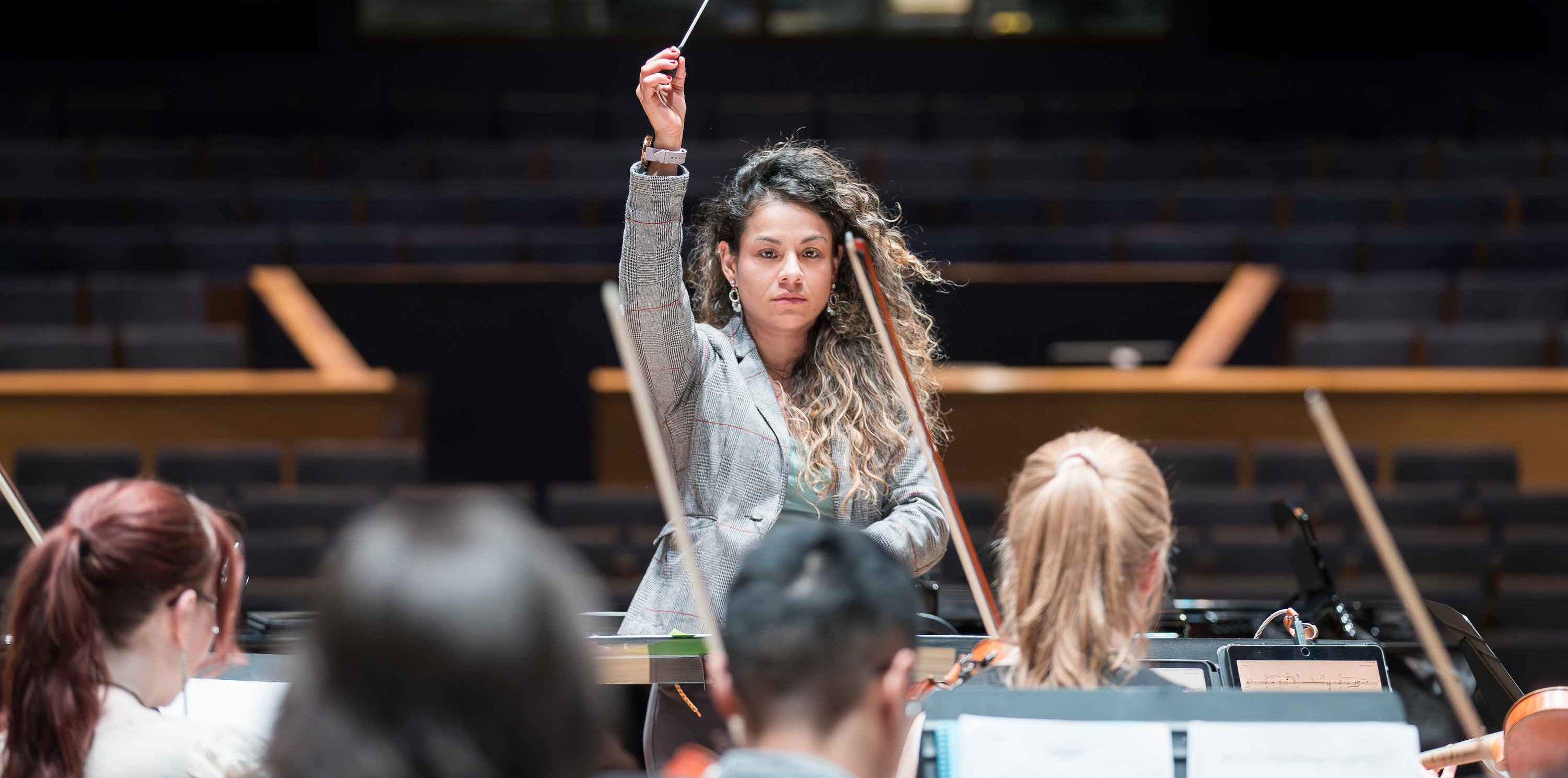 Jolie conducting an orchestra