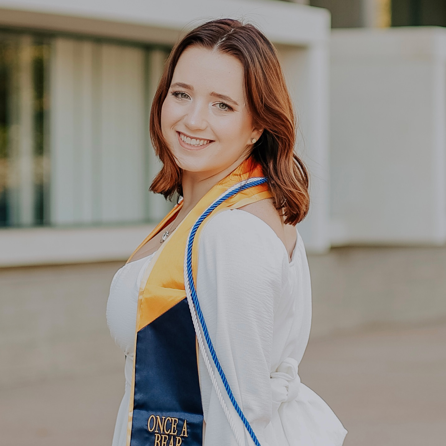 Julia Martin in her graduation gown smiling