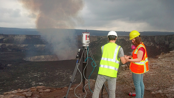 Dr. Anderson's former UNC graduate students Amy Burzynski and Adam Lewnter setting up a LiDAR scanner near the crater.