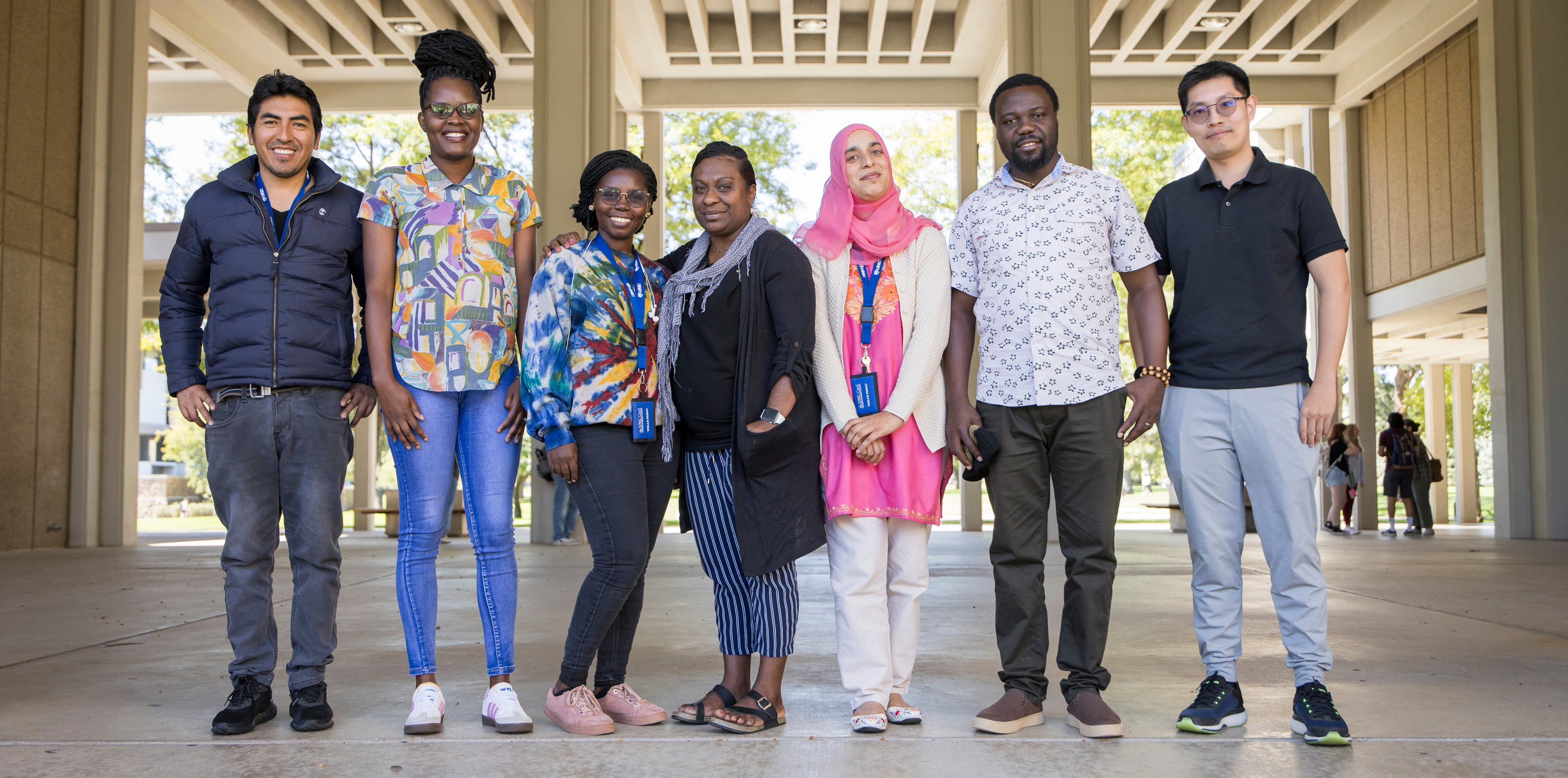 A group of international teachers posing outside