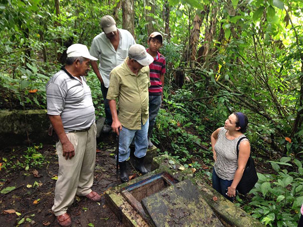 Sarah Romano at a well with water committee members in Nicaragua