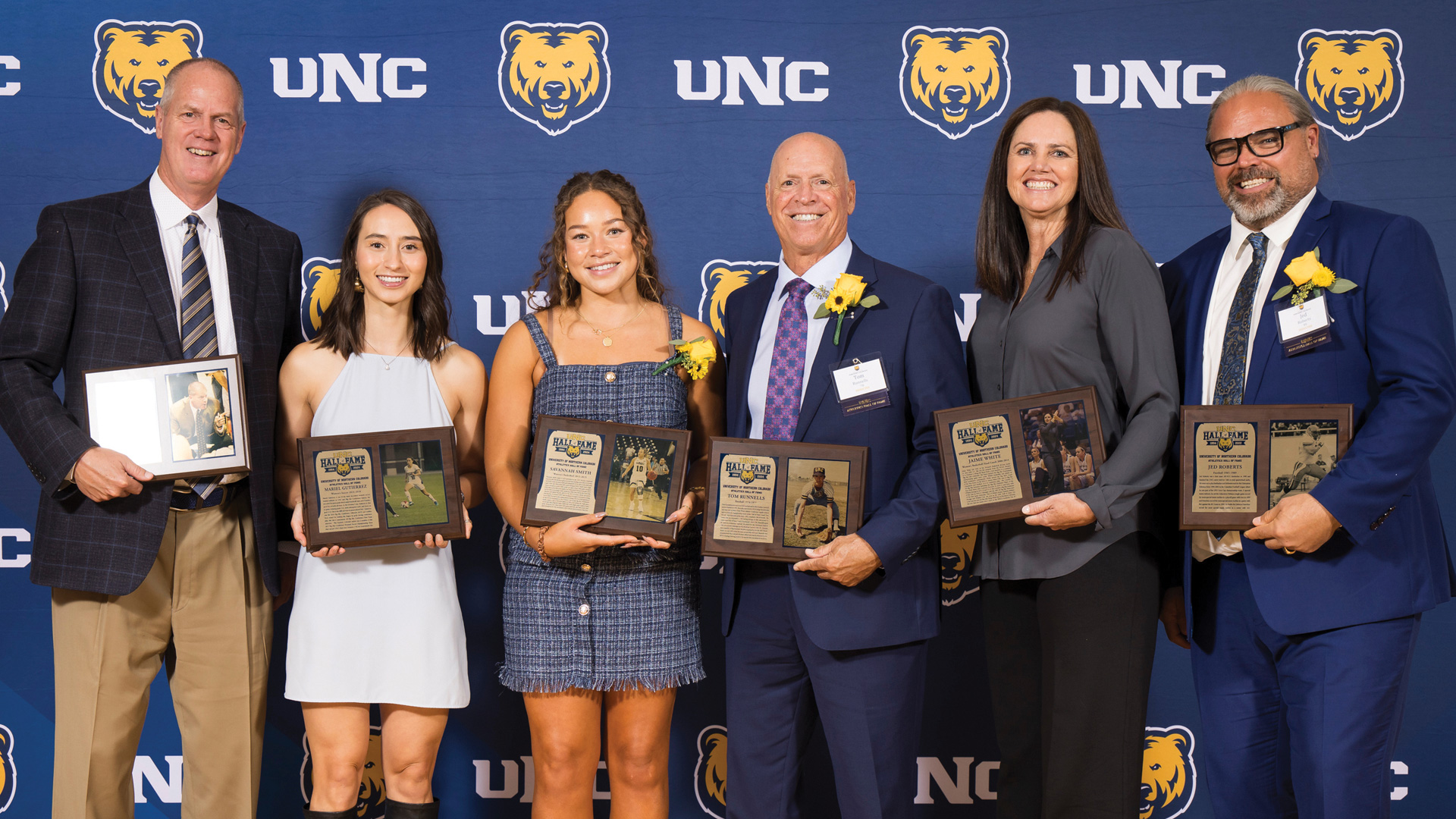 Tad Boyle, Mariel Gutierrez, ’18, Savannah Smith, ’19, Tom Runnells, Jaime White, and Jed Roberts pose with their plaques.