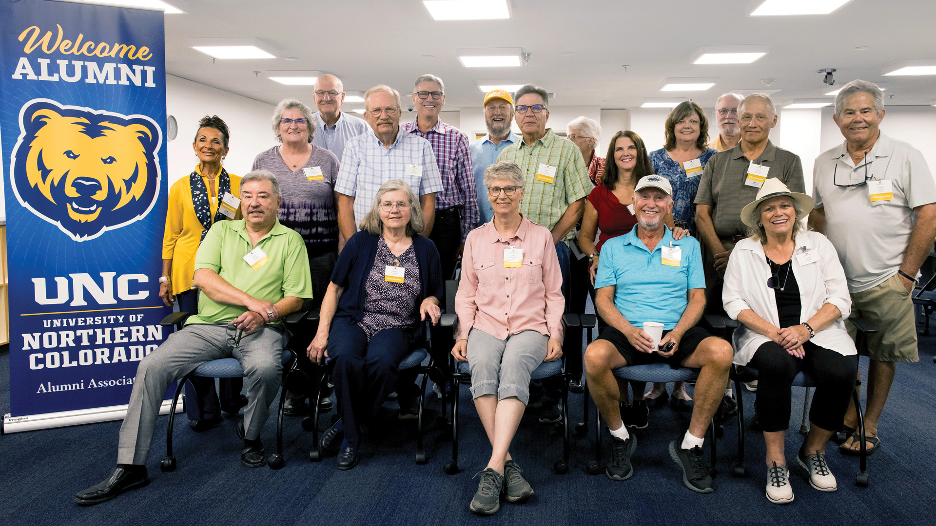 The class of 1975 stand together for a photo at their 50 year class reunion.