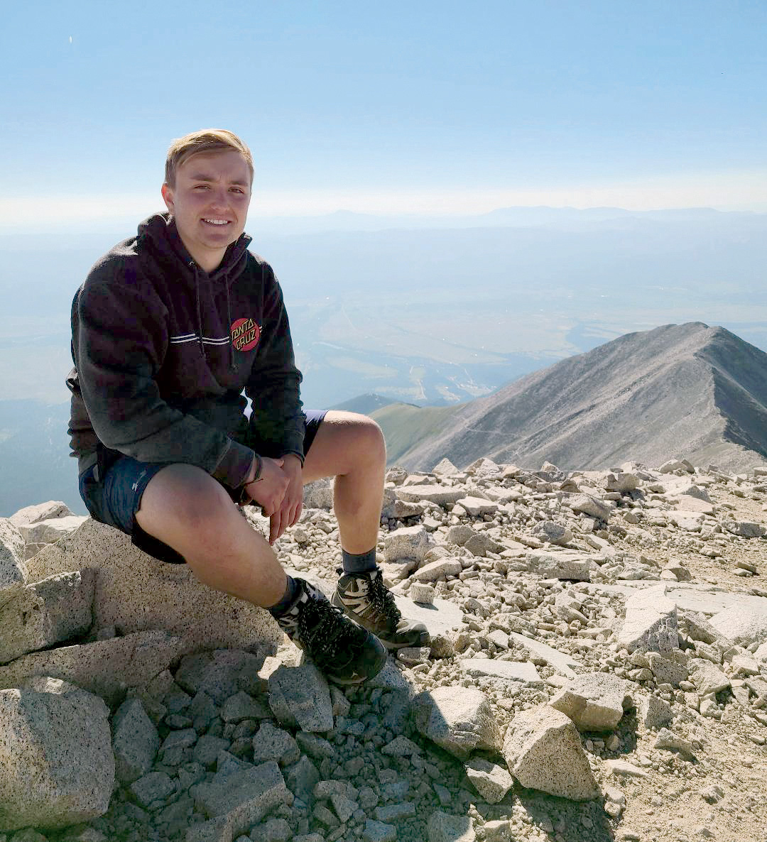 Nick Feinstein sits atop the summit of Colorado's Mt. Princeton.