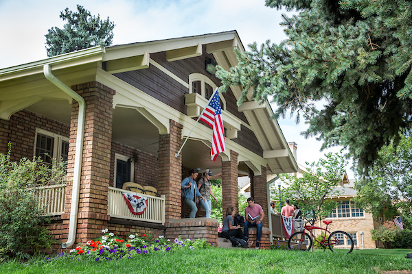 students outside the veteran service cottage