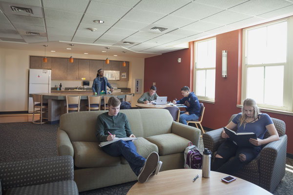 Students sitting in residence hall lounge